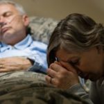 ill man with oxygen and woman by his bedside Queener Law