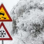 slippery snowy warning signs on road Queener Law