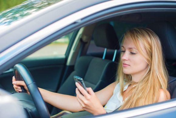 female teenager texting while driving Queener Law