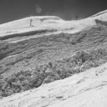 black and white photo of snow on hill Queener Law