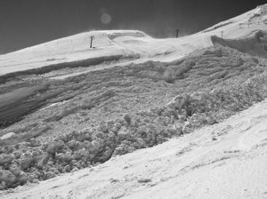 black and white photo of snow on hill Queener Law