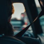 shadow of passenger in car wearing seatbelt Queener Law