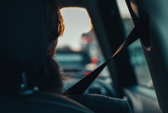 shadow of passenger in car wearing seatbelt Queener Law