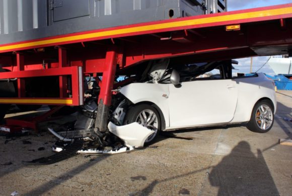 white car ends up under truck bed Queener Law