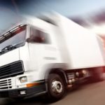 large white truck on road blurry background Queener Law