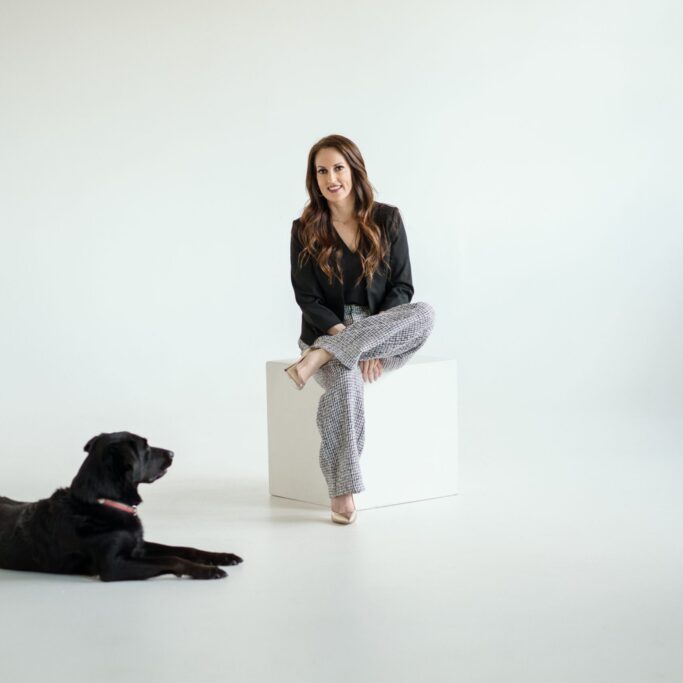 MAL_TeamPhotos_2024_0023 Photo of Jennifer O'Connell and her black Labrador. Queener Law, Personal Injury Lawyers of Colorado.