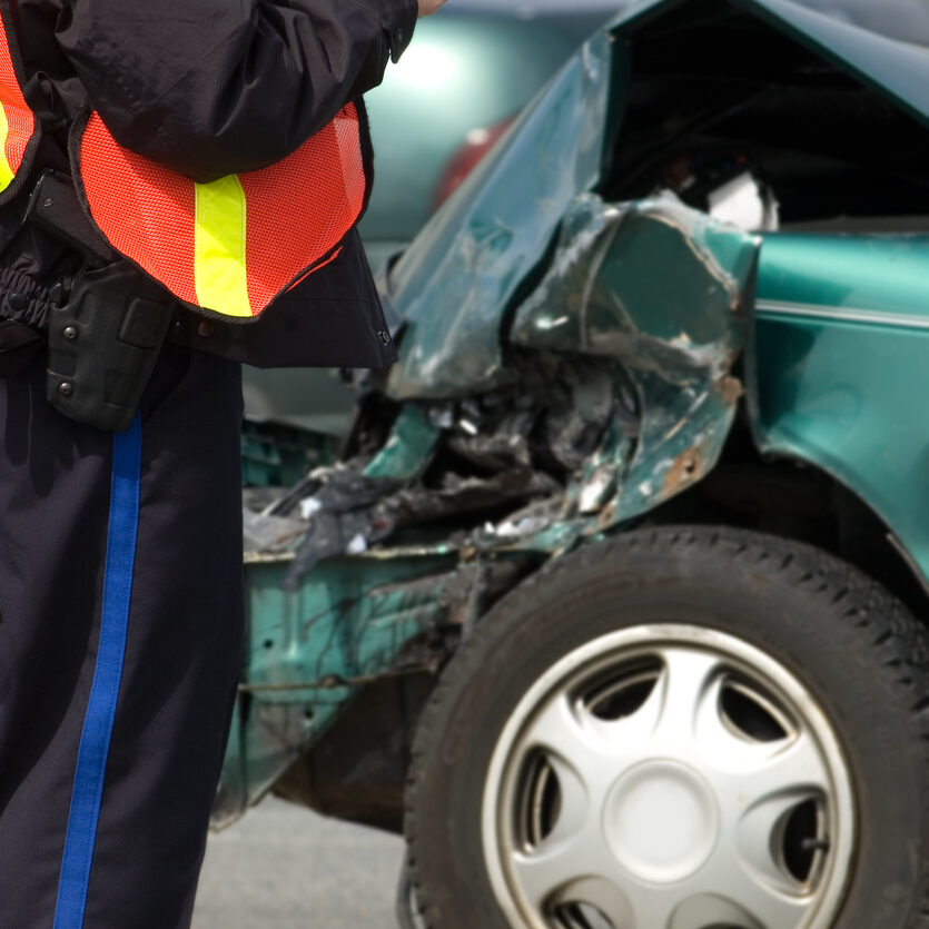 Accident Scene Image of a green car in a car wreck in Kentucky